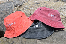 Load image into Gallery viewer, PEACE, LOVE AND BE UNBTHRD BUCKET HAT 100% COTTON UNISEX BUCKET HAT, ORANGE SODA, VINTAGE BLACK, FADED RED.